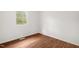 Bedroom with hardwood floors and a window at 809 S Plum St, Durham, NC 27701