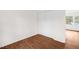 Bedroom features a closet with sliding doors and hardwood floors at 809 S Plum St, Durham, NC 27701