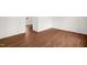 Clean bedroom with white walls, new hardwood floors, and great natural light at 809 S Plum St, Durham, NC 27701