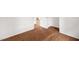Bright hallway with wood-look floors and white trim leading to other rooms in the home at 809 S Plum St, Durham, NC 27701