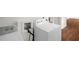 Laundry area with white washer and dryer at 809 S Plum St, Durham, NC 27701