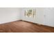 Inviting living area with fresh white walls and gorgeous hardwood floors at 809 S Plum St, Durham, NC 27701