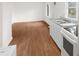 Open-concept living room offers hardwood floors and plenty of natural light at 809 S Plum St, Durham, NC 27701