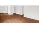 Open-concept living space with clean white walls and new modern hardwood flooring at 809 S Plum St, Durham, NC 27701