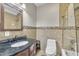 Bathroom with modern fixtures and tiled shower/tub combination at 8116 Hartwood Glen Cir, Willow Springs, NC 27592