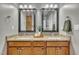 Bathroom featuring double vanity, granite countertops, and modern fixtures at 8116 Hartwood Glen Cir, Willow Springs, NC 27592