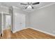 Bedroom featuring hardwood floors, closet doors and attached bathroom at 8116 Hartwood Glen Cir, Willow Springs, NC 27592
