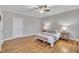 Bedroom featuring hardwood floors, ceiling fan and neutral colored decor at 8116 Hartwood Glen Cir, Willow Springs, NC 27592