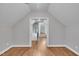 Bonus room with hardwood floors, neutral paint, and lots of natural light at 8116 Hartwood Glen Cir, Willow Springs, NC 27592