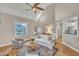 Cozy living room with high ceilings, lots of natural light, a comfortable seating area and views of the neighborhood at 8116 Hartwood Glen Cir, Willow Springs, NC 27592