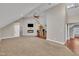 Open concept living area with fireplace, TV, bar and cozy carpet at 8116 Hartwood Glen Cir, Willow Springs, NC 27592