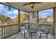 Inviting screened porch with comfortable seating, ceiling fan, and peaceful outdoor views at 8116 Hartwood Glen Cir, Willow Springs, NC 27592