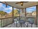 Relaxing screened porch with wood floors and decorative light fixture at 8116 Hartwood Glen Cir, Willow Springs, NC 27592