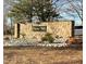 Stone community entrance sign for Horton Hills with rock landscaping and some greenery at 813 Woodside Park Ln, Durham, NC 27704