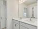 Bright bathroom with double sink vanity, a large mirror, and shaker-style cabinets at 89 Willow Cameron Way, Angier, NC 27501