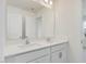 Bathroom featuring a double sink vanity with white cabinets and a large mirror at 89 Willow Cameron Way, Angier, NC 27501
