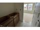 Bathroom in progress, cabinets with unfinished flooring and double window overlooking new construction at 89 Willow Cameron Way, Angier, NC 27501