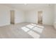 A look at a large carpeted bedroom with two doors and a window at 89 Willow Cameron Way, Angier, NC 27501