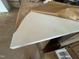 The countertop has a white and grey marble design that is partially covered by paper at 89 Willow Cameron Way, Angier, NC 27501