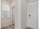Clean and modern entryway features a side window, front door, and open doorway at 89 Willow Cameron Way, Angier, NC 27501
