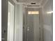 New construction entryway with white door, transom window, and fresh drywall ready for finishing at 89 Willow Cameron Way, Angier, NC 27501