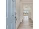 A naturally lit entryway leading into the home, showcasing the stairway and living area at 89 Willow Cameron Way, Angier, NC 27501