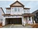 New construction home featuring a garage and ample windows at 89 Willow Cameron Way, Angier, NC 27501