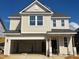 Charming two-story home with attached garage, light siding, and architectural roof shingles at 89 Willow Cameron Way, Angier, NC 27501