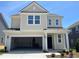 Charming two-story home with attached two-car garage and covered front porch with craftsman-style columns at 89 Willow Cameron Way, Angier, NC 27501