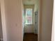 Hallway with natural light, traditional trim and fixtures and neutral paint colors at 89 Willow Cameron Way, Angier, NC 27501
