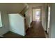 Hallway with natural light, traditional trim and fixtures and neutral paint colors at 89 Willow Cameron Way, Angier, NC 27501