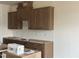 The kitchen has a modern design with shaker cabinets, a white backsplash, and dark hardware at 89 Willow Cameron Way, Angier, NC 27501