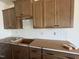 Kitchen featuring new dark cabinets and drawers and a herringbone tile backsplash at 89 Willow Cameron Way, Angier, NC 27501
