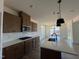 Kitchen featuring an island with a sink, stainless steel appliances, and plenty of cabinet space at 89 Willow Cameron Way, Angier, NC 27501