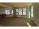Unfurnished living room featuring large windows, natural light, and an open floor plan at 89 Willow Cameron Way, Angier, NC 27501