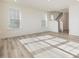 Open floorplan with wood floors, natural light, and staircase to the second level at 89 Willow Cameron Way, Angier, NC 27501