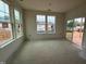 Bright living area with multiple windows, creating a warm and inviting space at 89 Willow Cameron Way, Angier, NC 27501