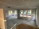 Unfinished living room space featuring drywall, windows, and ample natural light at 89 Willow Cameron Way, Angier, NC 27501