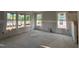 Unfinished living room with large windows and drywall, ready for customization at 89 Willow Cameron Way, Angier, NC 27501