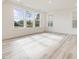 Bright and airy living room with large windows offering a view of the surrounding landscape at 89 Willow Cameron Way, Angier, NC 27501