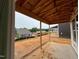 View of new construction backyard, featuring a covered porch at 89 Willow Cameron Way, Angier, NC 27501