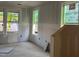 Unfinished room with drywall and three windows allowing natural light to enter the space at 89 Willow Cameron Way, Angier, NC 27501