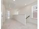 Upstairs hallway with carpet, window and doors leading to the rooms at 89 Willow Cameron Way, Angier, NC 27501