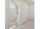 Walk-in closet with carpet flooring, wire shelving, and a bathroom with shower in the background at 89 Willow Cameron Way, Angier, NC 27501