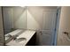 Functional bathroom with a quartz countertop vanity, and framed mirror at 921 Emmer St, Rolesville, NC 27571