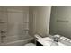Clean bathroom featuring a shower-tub combo and a modern vanity at 921 Emmer St, Rolesville, NC 27571