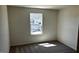 Serene bedroom featuring soft carpeting and a window with neighborhood views at 921 Emmer St, Rolesville, NC 27571