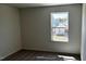 Bright bedroom with soft carpeting and a large window offering a picturesque view at 921 Emmer St, Rolesville, NC 27571