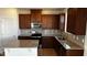 Modern kitchen featuring granite countertops, stainless steel appliances, and ample cabinet space at 921 Emmer St, Rolesville, NC 27571
