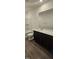 A modern bathroom features a vanity with wood cabinets and a shower-tub combo at 937 Emmer St, Rolesville, NC 27571